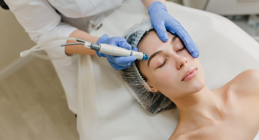 view-from-above-rejuvenation-of-beautiful-woman-enjoying-cosmetology-procedures-in-beauty-salon-dermatology-hands-in-blue-glows-healthcare-therapy-botox